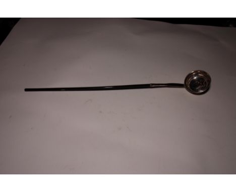 A 19th Century silver plated punch ladle, bowl inset coin dated 1696, whalebone handle, 17" long