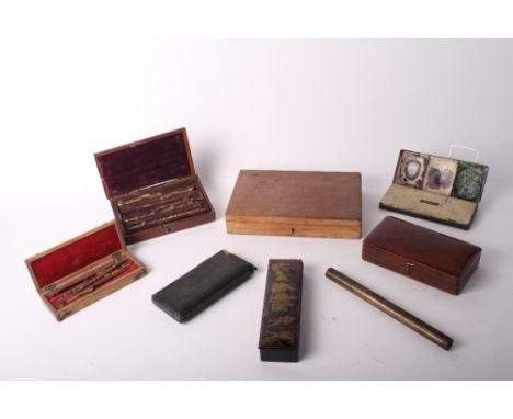 A Chinoiserie papier-mâché pencil box, a cased set of drawing instruments, two similar sets, a number of other drawing instru