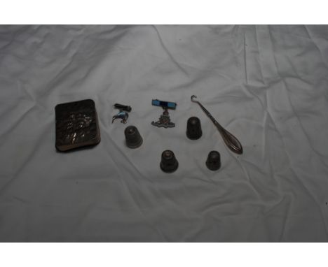 A miniature silver faced prayer book, four silver thimbles, a silver handled button hook and two silver brooches