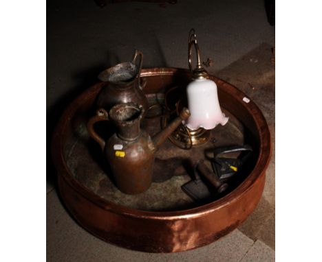 An Art Deco copper pendant lamp with hemispherical bowl and copper shade supported by three chains