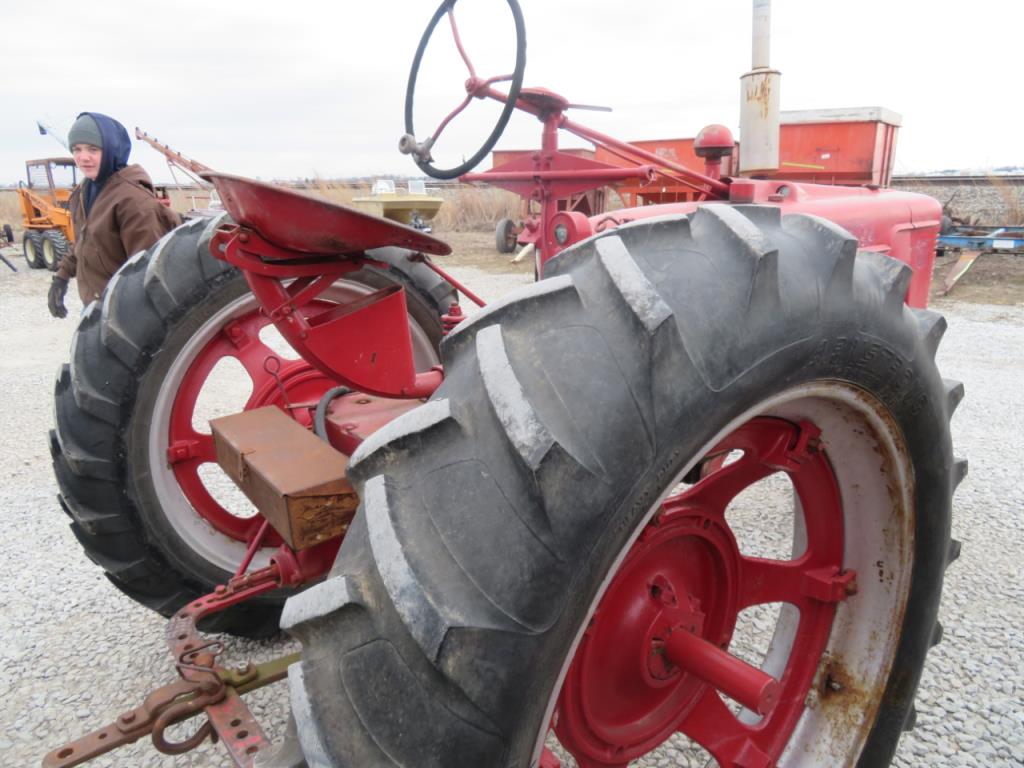 1945 Farmall H Extra Seat and Belts with it. Runs Good.