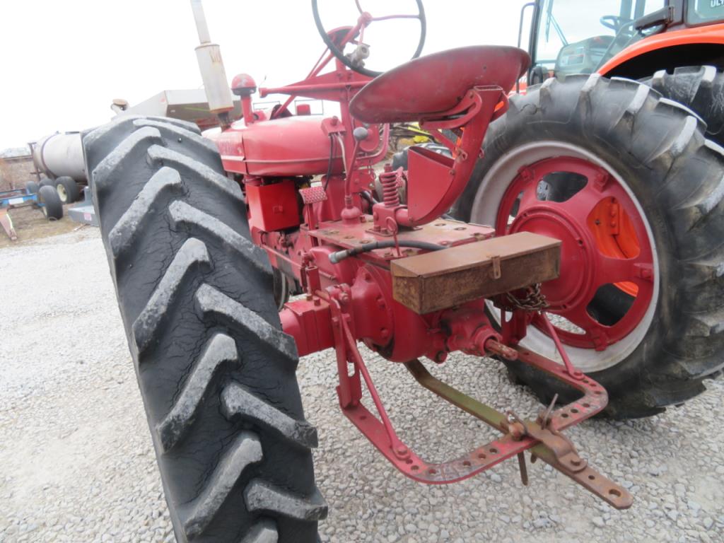 1945 Farmall H Extra Seat and Belts with it. Runs Good.