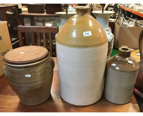 A salt glazed studio pottery crock with decoration in the manner of Cardew with pitched pine cover, a large stoneware flagon 