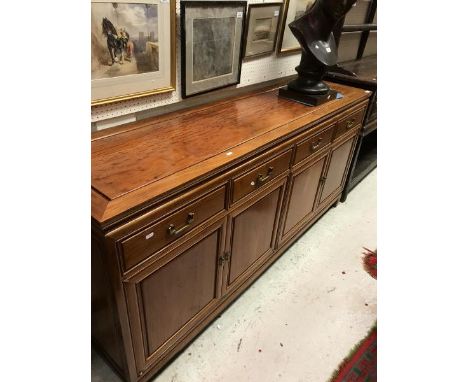 A Chinese hardwood sideboard the four drawers above four cupboard doors on bracket feet together with a rosewood table and se