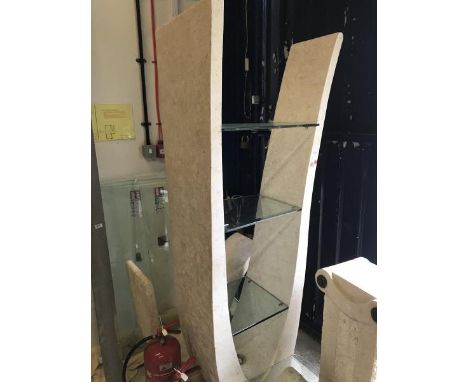 A reconstituted stone lyre shaped wall shelf with glass shelving, a matching glass topped occasional table and coffee table