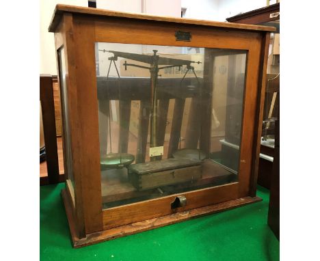 A pair of late Victorian mahogany cased precision scales bearing label "Townson &amp; Mercer Ltd, London EC3" together with a