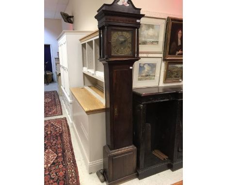 An 18th Century oak longcase clock of slim proportions, the 30-hour movement by Thomas Taylor of Worcester, the face with Rom