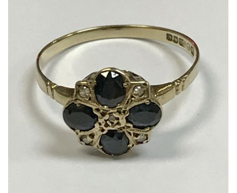 A 9 carat gold diamond and sapphire set ring, 1.5 g, size R