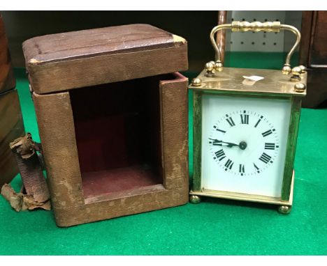 An early 20th Century brass cased French carriage clock, the chapter ring with Roman numerals, the top inscribed "J. Cave" ho
