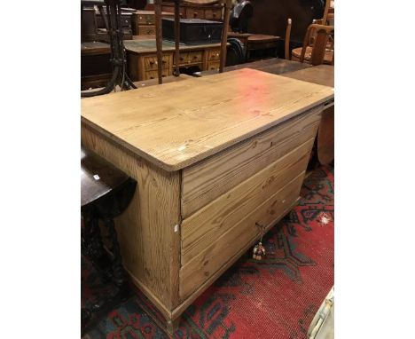 A 19th Century continental pine commode of three drawers 