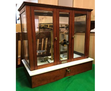 A set of circa 1900 mahogany and glazed cased precision scales with integral microscope bearing label "Maison Besson Société 