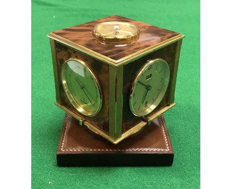 A Hermès Hall Dupre-Lafon rotating compendium desk clock with compass, clock, barometer, thermometer, the clock with date ape