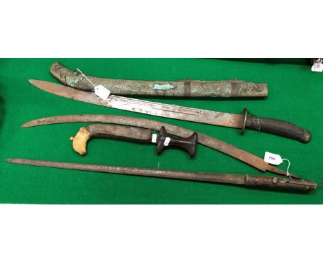 A 19th Century oriental sword with slightly curved fullered blade and half hilt and strap work decorated handle with engraved