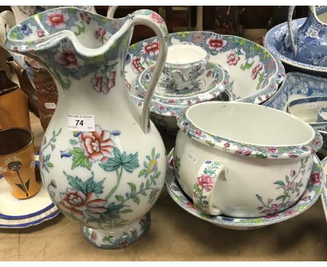 A Copeland (late Spode) floral decorated toilet set comprising jug, bowl, chamber pot, smaller bowl, two pedestal dishes and 