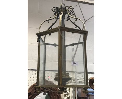 A lacquered brass-framed hexagonal glazed hanging lantern, together with a 1001 Lamps Limited anglepoise lamp CONDITION REPOR