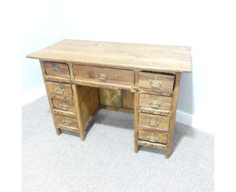 A Vintage pitch pine Desk, seven drawers, W x 101cm x H 72cm x D 46cm. 