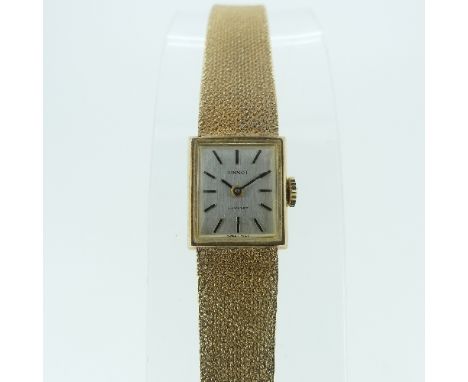 A lady's 9ct gold Tissot Stylist Wristwatch, with square silvered dial and baton markers, the integrated 9ct gold flexible br