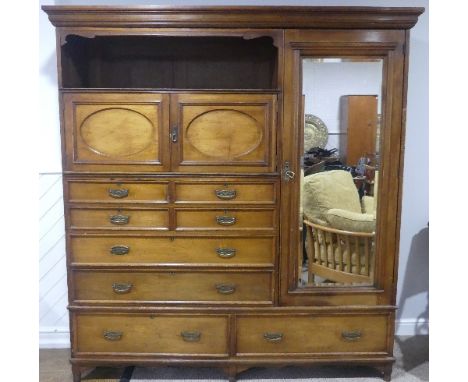 An Edwardian mahogany Compactum wardrobe by Maple &amp; Co.,&nbsp;labelled "Maple and Co. Tottenham Court Road, London" on in