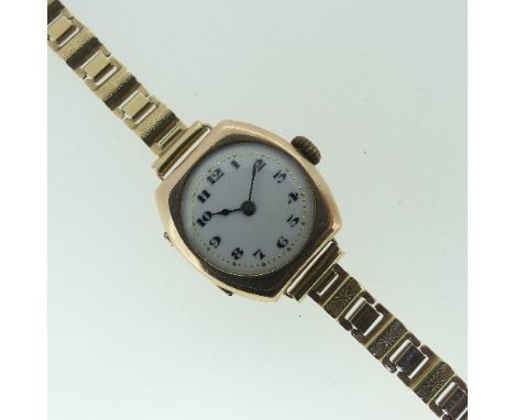 A 9ct gold lady's Wristwatch,&nbsp;with Arabic numerals on white enamel dial, engraved initials and presentation inscription 