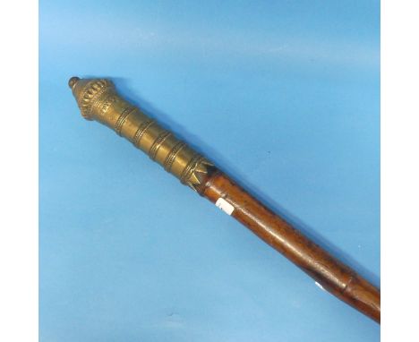 Tribal Art: a late 19thC Indian bamboo Chaukidar's Lathi, (Watchman's Staff), with decorative cast brass ferrules, the base e