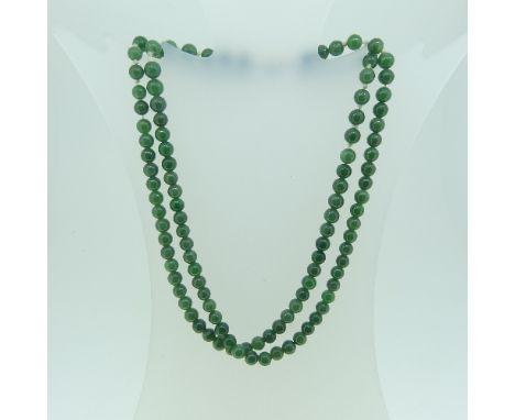 A double row spinach green Jade Necklace, the circular stones each approx 6mm diameter, 116 stones in total, on a 9k gold sna