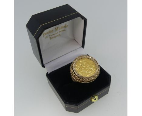 A George V gold half Sovereign, dated 1911, in 9ct gold ring mount with pierced decoration, ring size R, total weight 8.5g.