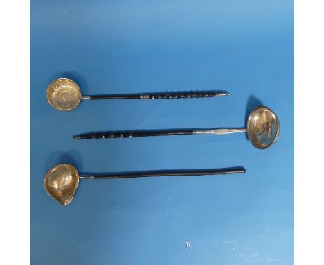 A mid 18thC silver Toddy Ladle,&nbsp;the circular bowl inset with a George II shilling dated 1758, with foliate and bird deco