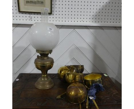 A set of three vintage hanging Scales, the brass bodies with brass bowls, together with a vintage brass oil Lamp (4) 