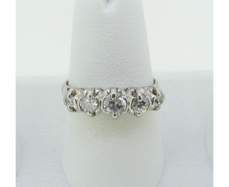 A graduated five stone diamond Ring, the centre stone c¼ct., all mounted in unmarked white metal, tested as platinum, Size M,