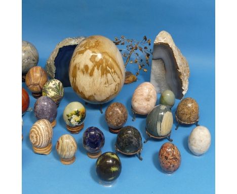 A collection of polished semi-precious stone Eggs and Spheres, including examples of Blue John, Agate, Amethyst, Serpentine, 