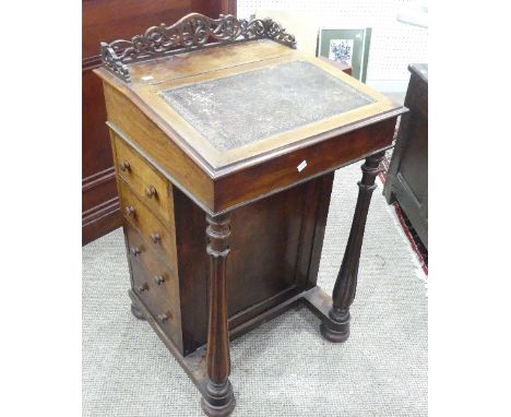 A Victorian rosewood 'Davenport' lady's Desk,&nbsp;with fretwork gallery, inset leather top opening to reveal a fitted interi