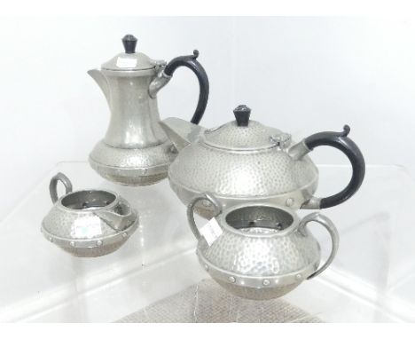 An Arts &amp; Crafts style pewter four piece tea Service, teapot, hot water Jug, creamer and sugar bowl, marked 'Sheffield Pe