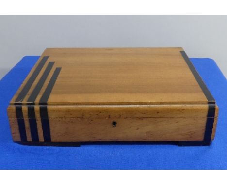 An Art Deco style canteen of silver plated Cutlery, bearing label for Barwick &amp; Haggas, Keighley, in Art Deco-style woode