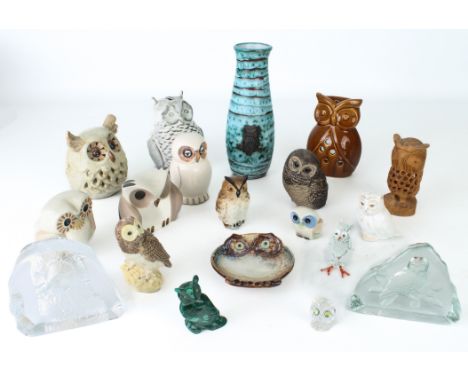 A small collection of Owls in pottery, bone china, glass, carved stone and carved wood - including an example in carved malac