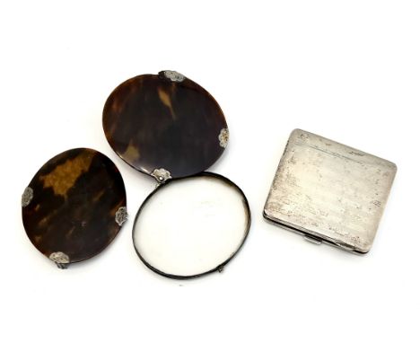 A Georgian tortoiseshell and white metal folding magnifier - oval, with scalloped hinges and clasp (the hinges and clasp a/f)