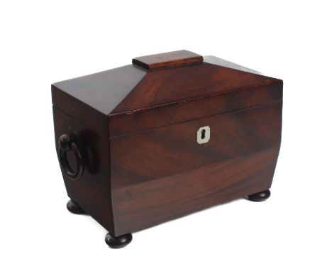 A small Regency mahogany sarcophagus shaped tea caddy&nbsp;in fine original condition -&nbsp;with mahogany loose ring handles