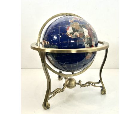 A gemstone table globe - modern, the 12in globe on an antiqued, brushed brass finished tripod stand, 47cm high.