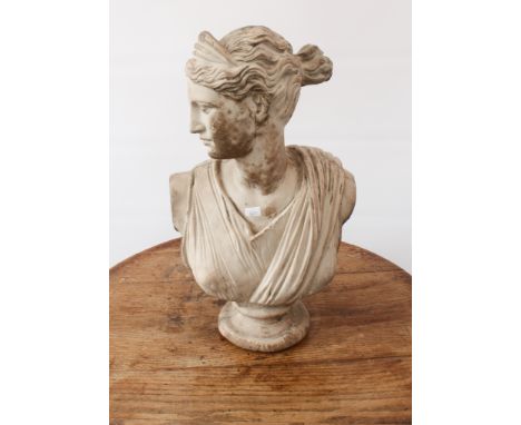 A reconstituted stone classical bust of Diana - after the antique, 47 cm high.