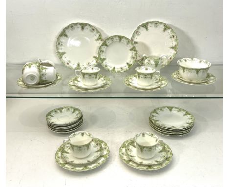 An Edwardian Heathcote China 'Sefton' pattern part tea service - printed factory marks, decorated in in a pink and green flor