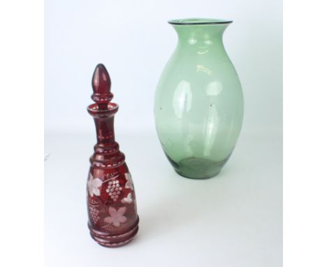 A large hand blown green glass vase - of baluster form, 41cm high; together with a Bohemian ruby flashed and cut glass decant