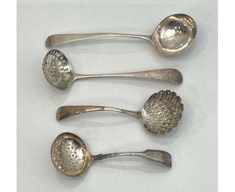 Four silver ladles - comprising a George III Old English pattern sifter ladle, London 1798; a George III silver sauce ladle (