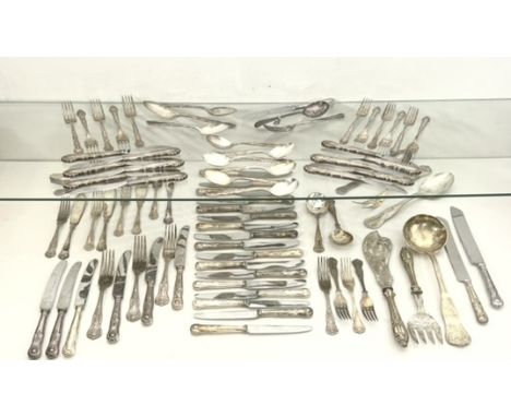 A matched part set of silver plated Kings pattern flatware - including two bread knives; a soup ladle; a large serving fork a