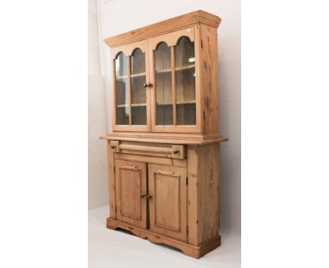 A late-19th&nbsp;century French stripped-pine glazed dresser &ndash; the flared cornice over a pair of double-arched glazed d