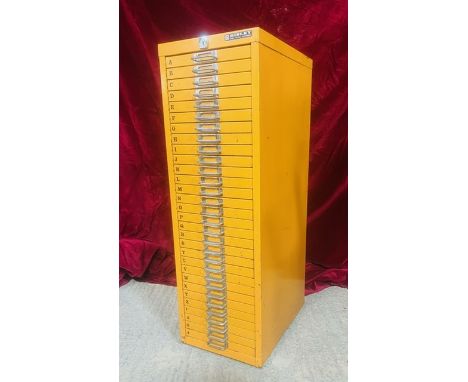 A vintage Bisley painted steel tool, parts or collectors cabinet - painted dark yellow, fitted with thirty drawers (no key). 