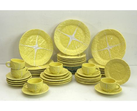 A Portuguese yellow glazed cabbage leaf pattern part dinner service &ndash; late 20th&nbsp;century, printed factory marks, co