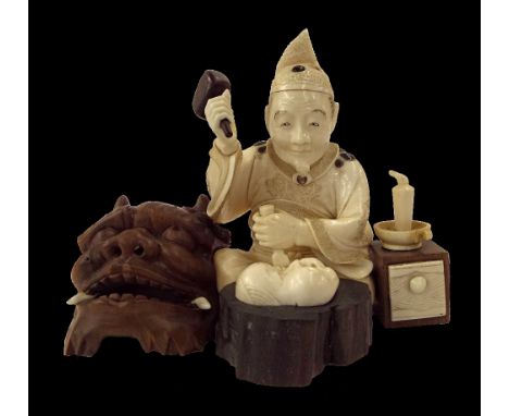 Japanese ivory okimono, carved and modelled as a seated gentleman mask maker holding a wooden mallet and chisel, with a carve