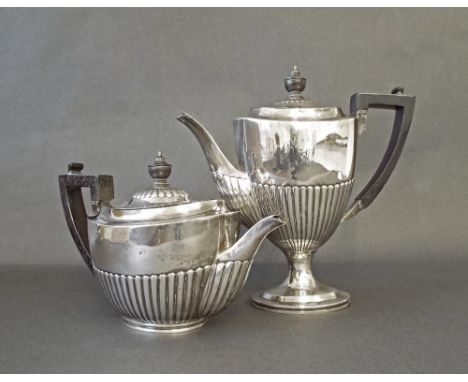 Victorian silver half fluted part tea service comprising teapot and water pot, maker Charles Boyton, London 1883, 6" and 8.5"