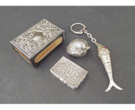 Edwardian silver vesta case, the top embossed with scrolled foliage and cherubs, Birmingham 1900, 2.5" long; .925 import silv