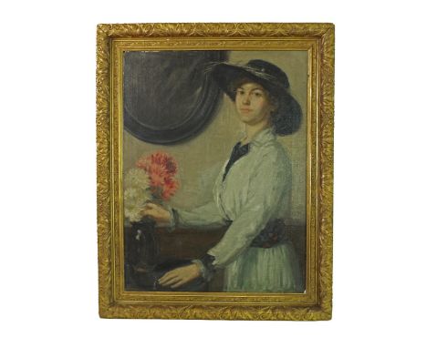 Follower of William Orpen (20th century) - portrait of a young lady standing three-quarter length wearing a cream dress and b