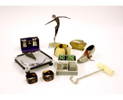 Interesting Items to include cased mother of pearl opera glasses, collection of various napkin rings, chrome figure in the fo